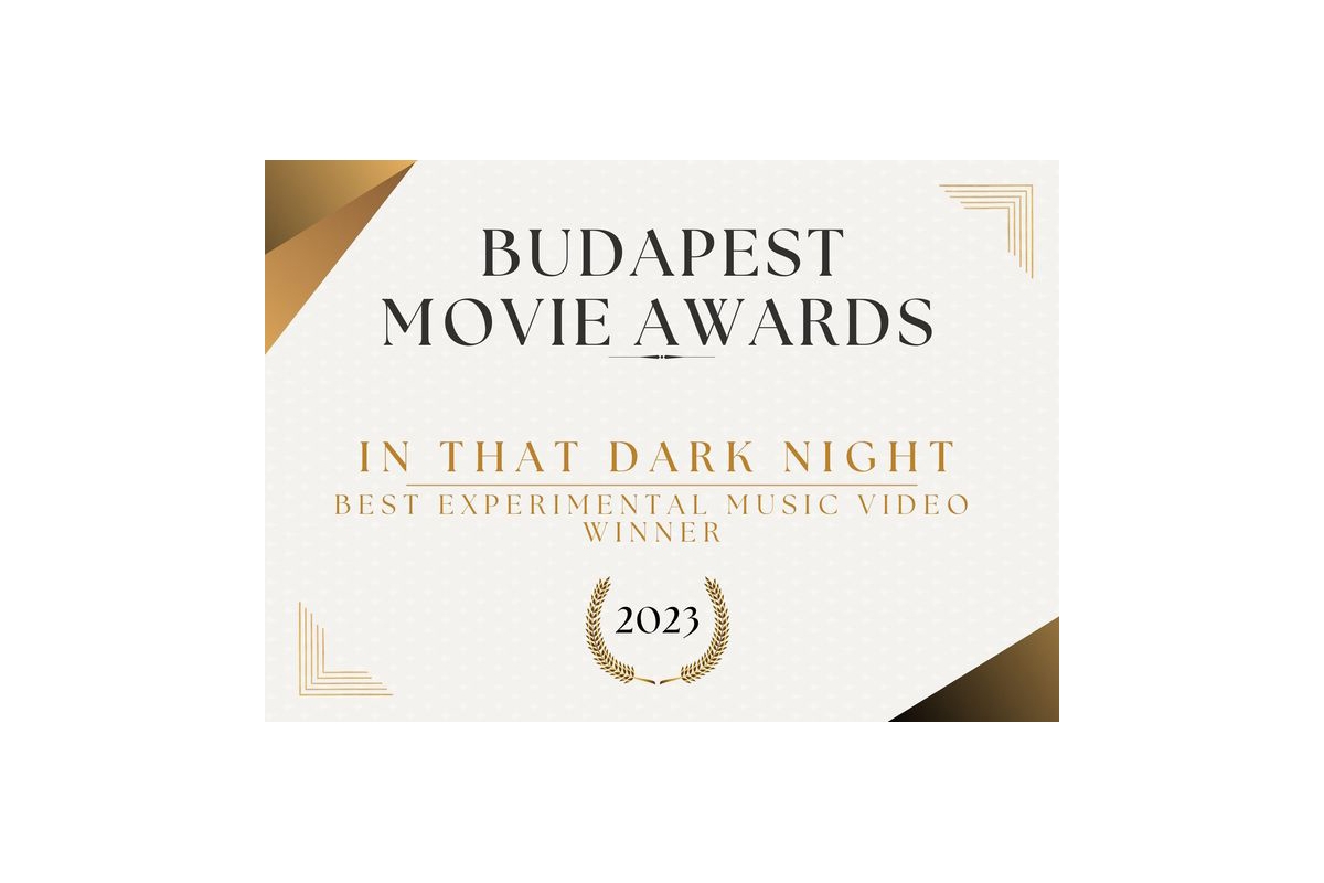 Budapest Movie Awards certificate with gold and cream design featuring geometric triangular elements, announcing "In That Dark Night" as 2023 Best Experimental Music Video winner.