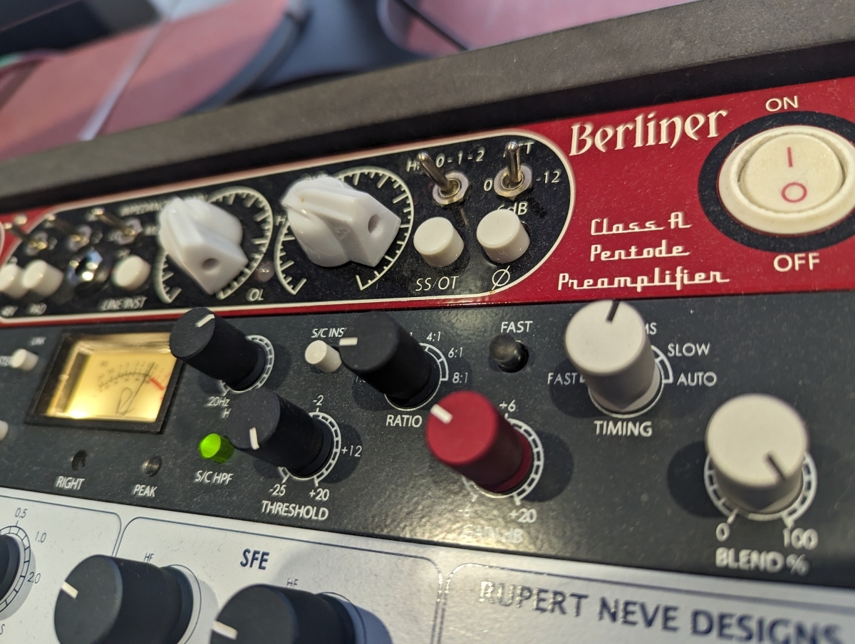 Vintage Berliner Class A Pentode Preamplifier with analog VU meter, control knobs, red power button, and cream-colored switches on dark panel