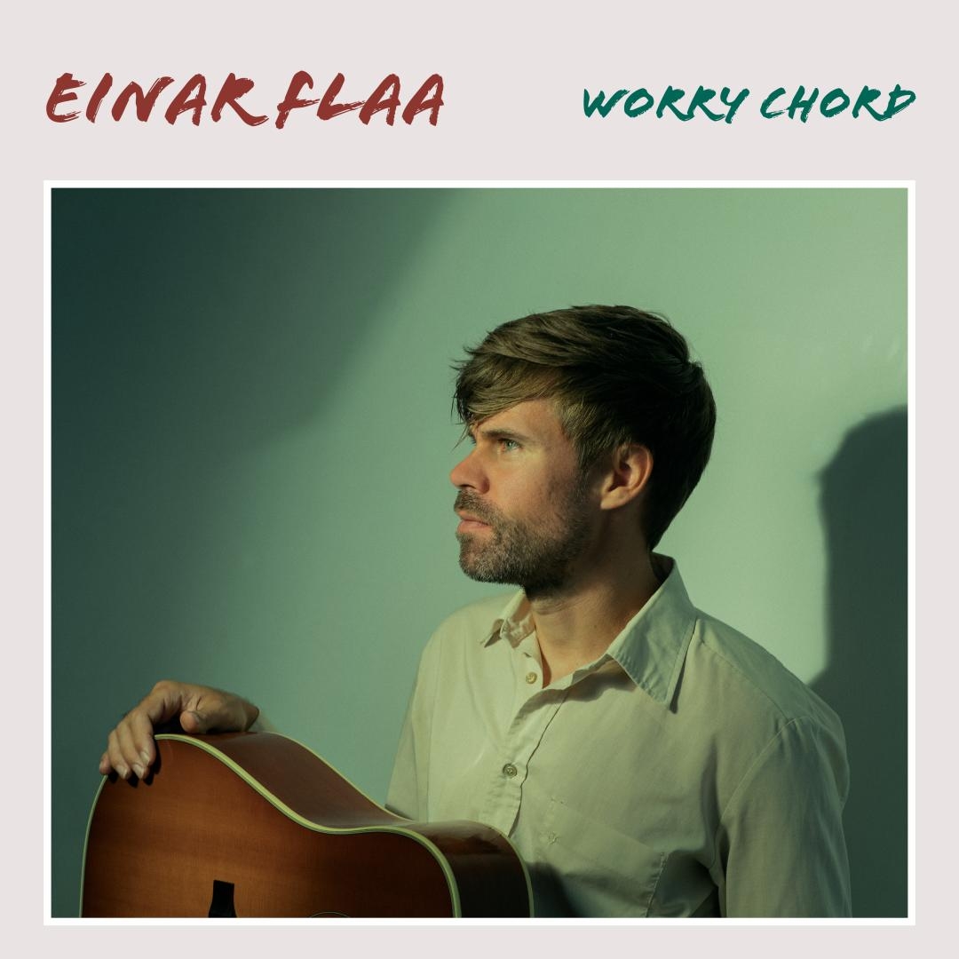 Album cover showing bearded man in light green shirt holding acoustic guitar, gazing left against mint green background with soft lighting and shadows