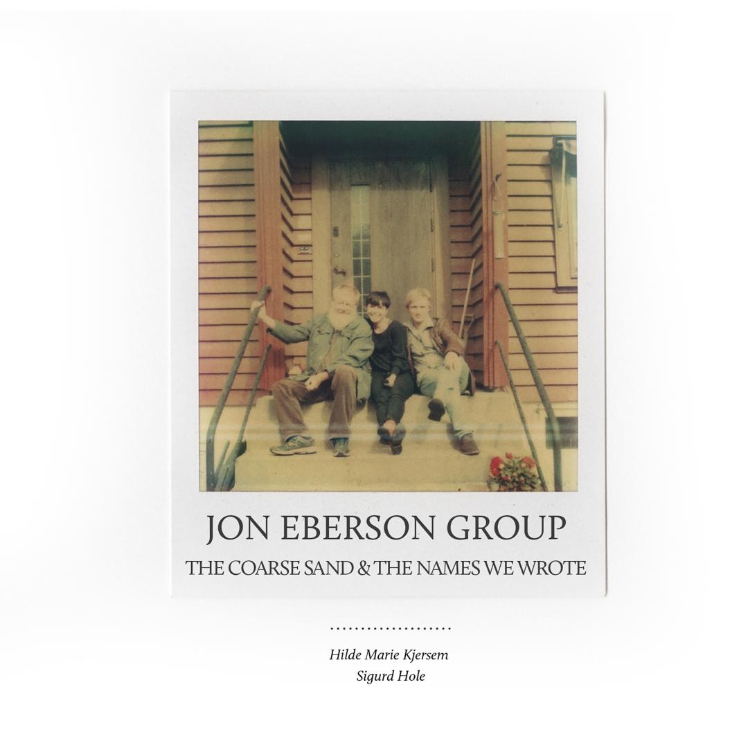 Album cover showing three musicians sitting on concrete steps of a wooden building. Vintage sepia-toned photo with warm yellow and brown hues creates nostalgic mood.