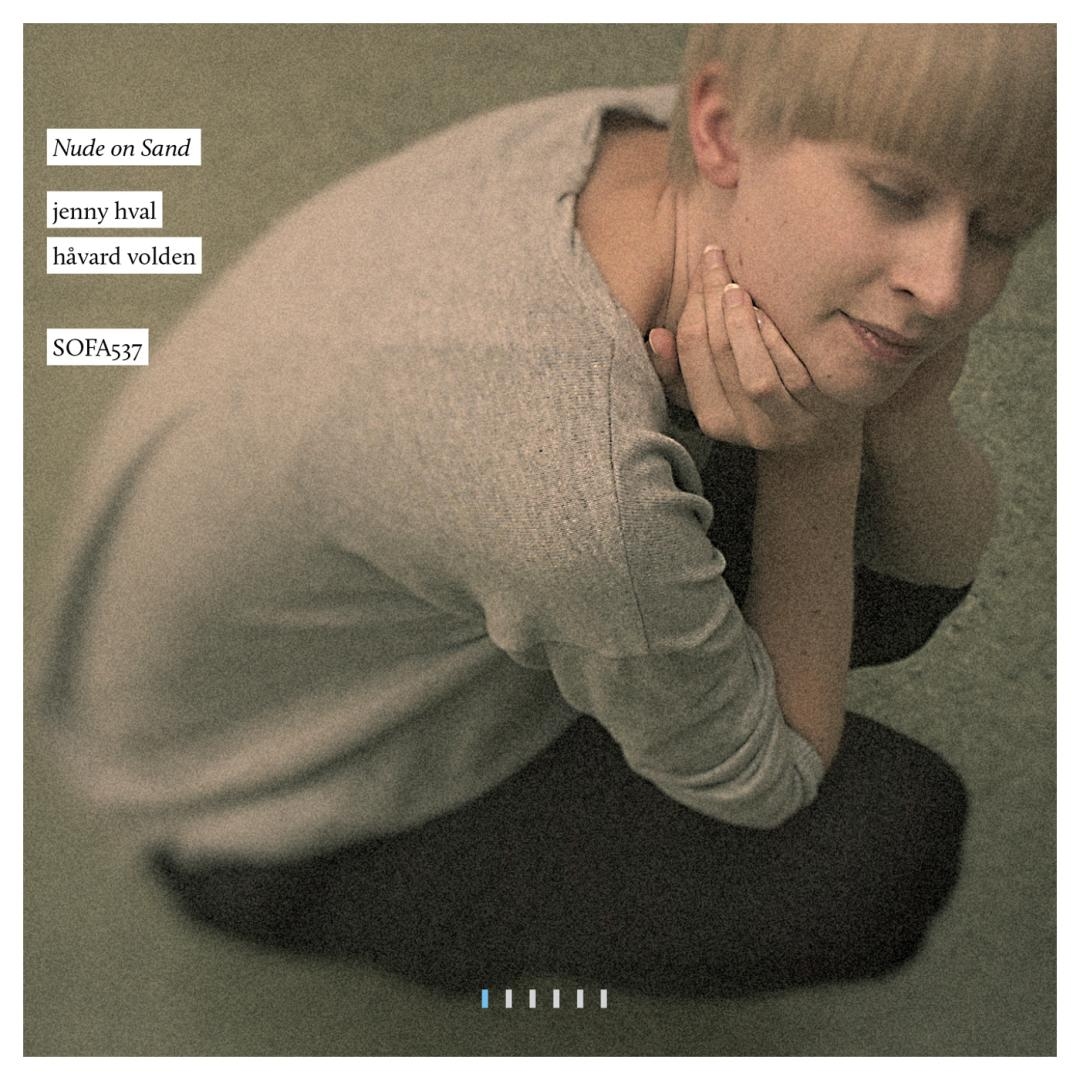 Album cover showing person in contemplative pose on sand, muted beige and brown tones, soft lighting, introspective mood with text overlay.