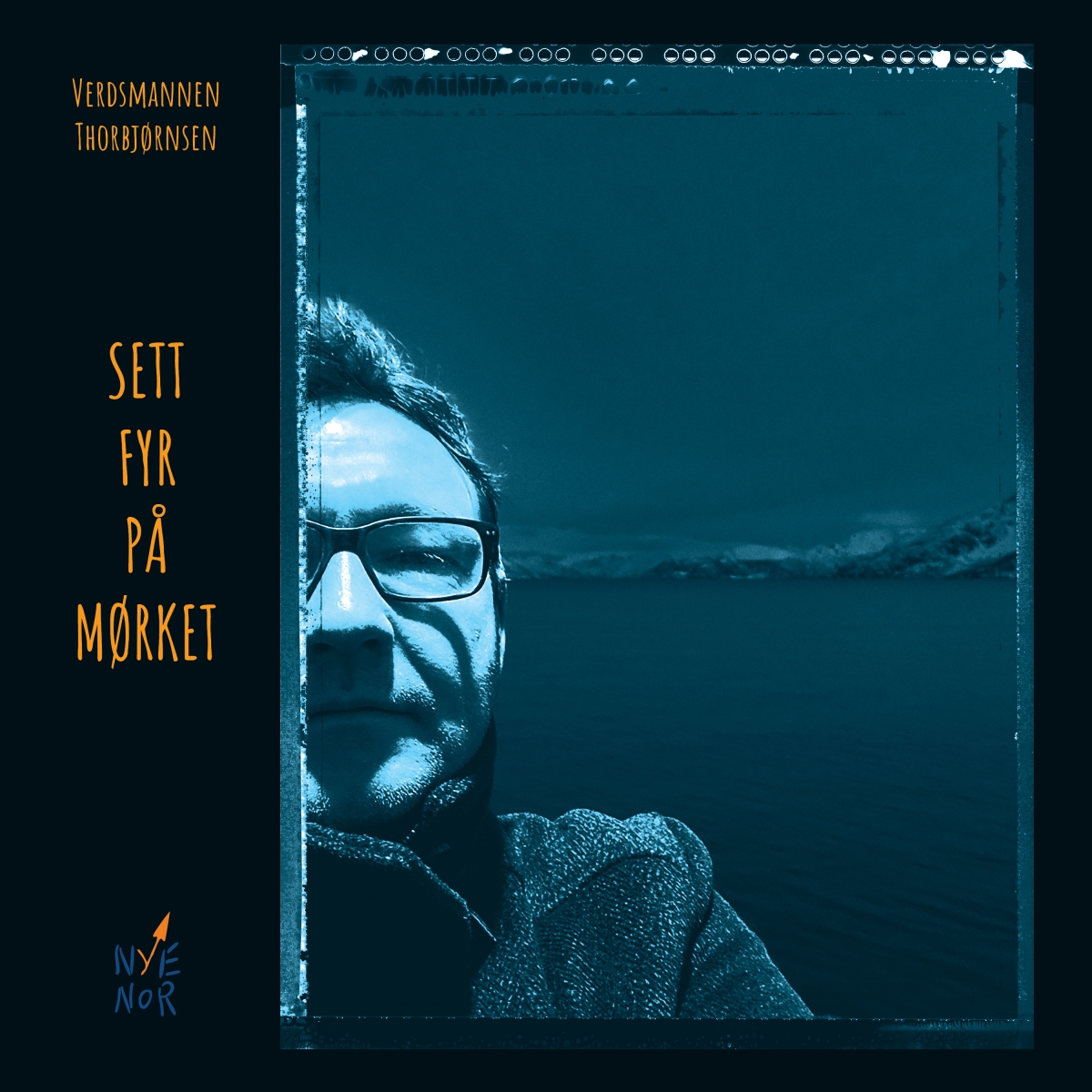 Album cover featuring a man with glasses and beard in blue-tinted portrait against dark background, with Norwegian text "Sett Fyr På Mørket" and artist name "Verdensmannen Thorbjørnsen