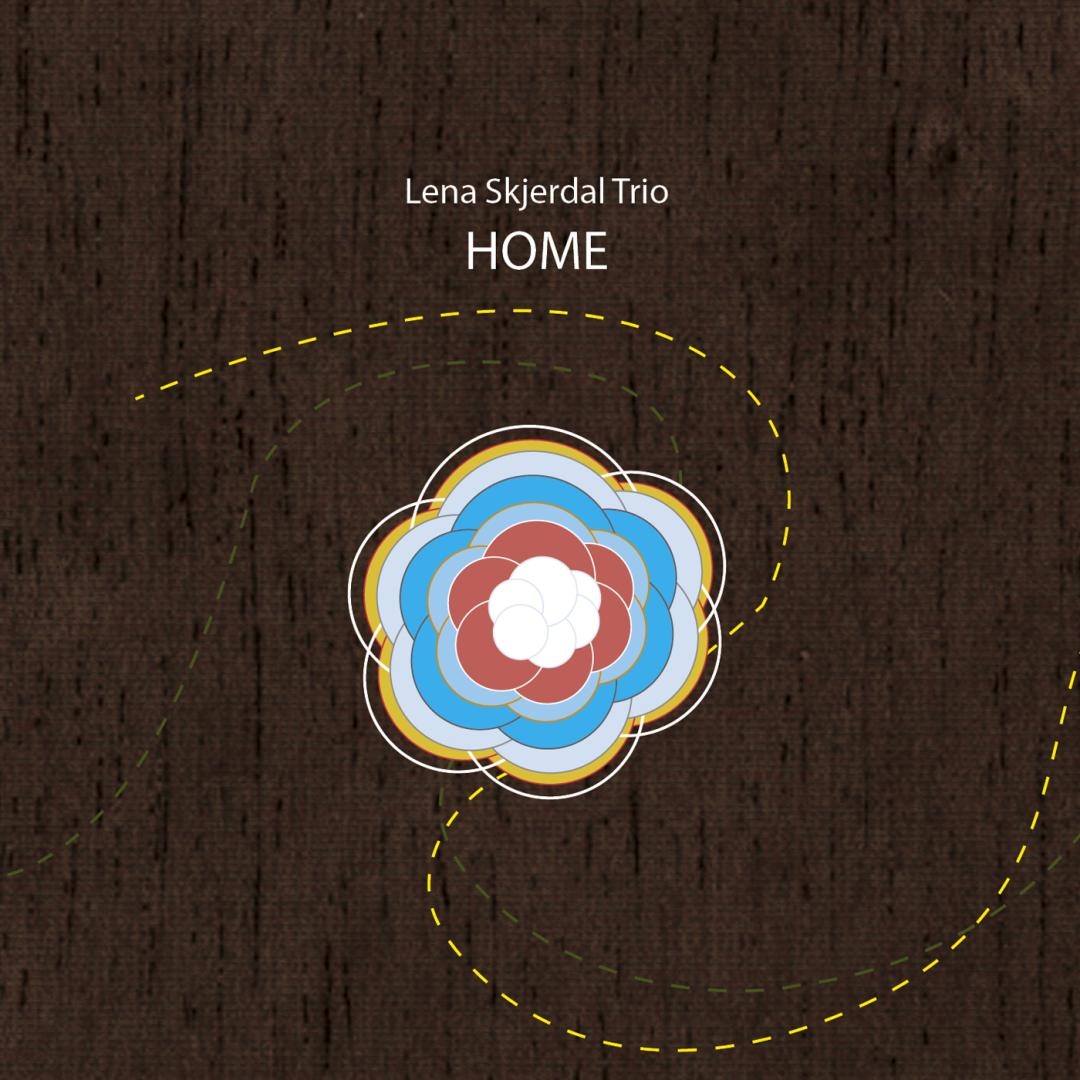 Album cover for "Home" by Lena Skjerdal Trio featuring a colorful flower-like mandala with concentric petals in white, red, blue, yellow against dark textured background with yellow dashed circle