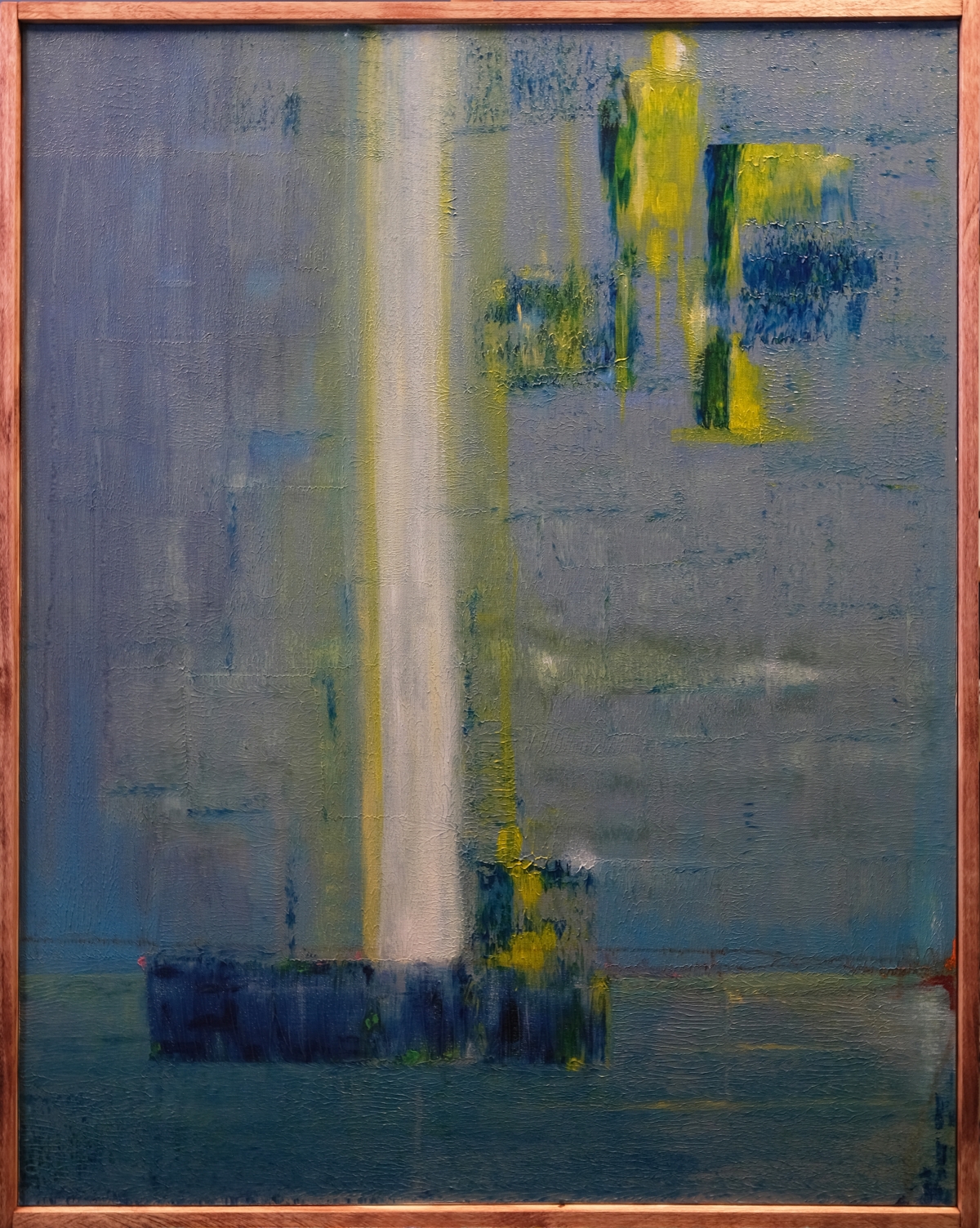 Abstract painting with vertical white-yellow beam and blue-green brushstrokes on gray background, framed in light wood, creating moody atmospheric composition.