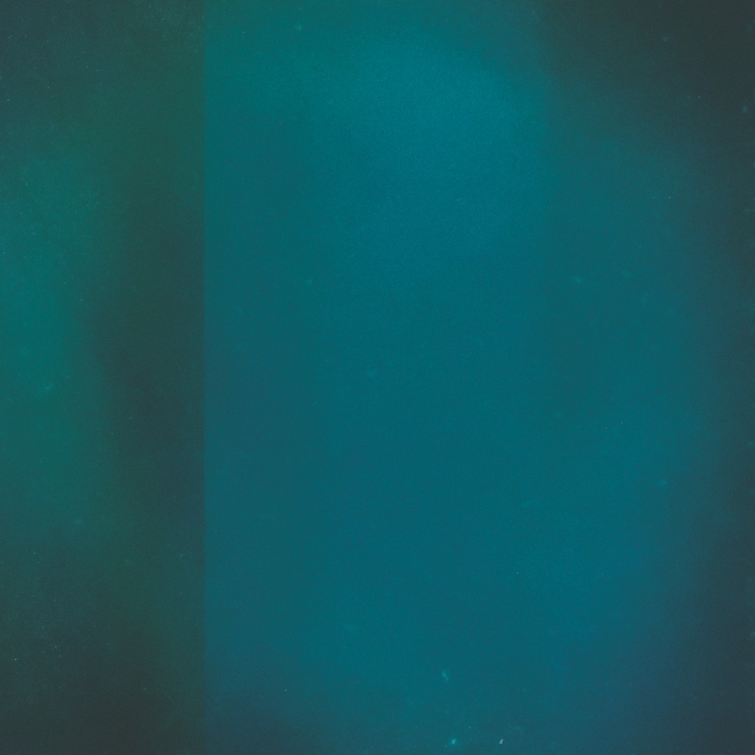 Deep teal and turquoise gradient background with subtle texture variations, creating a calm, ocean-like atmospheric mood with darker edges fading to lighter center.